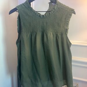 Green sleeveless blouse